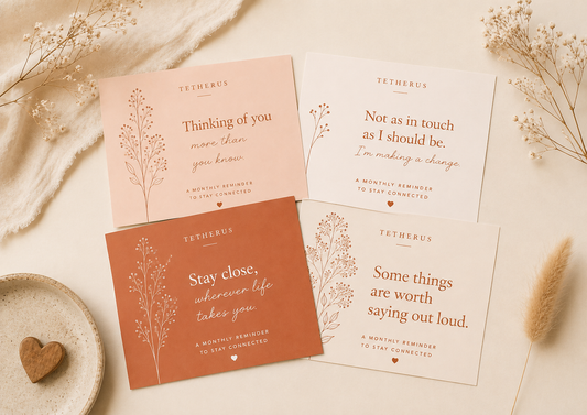 Four heartfelt cards from Tetherus on a light background with dried flowers and a heart-shaped object.
